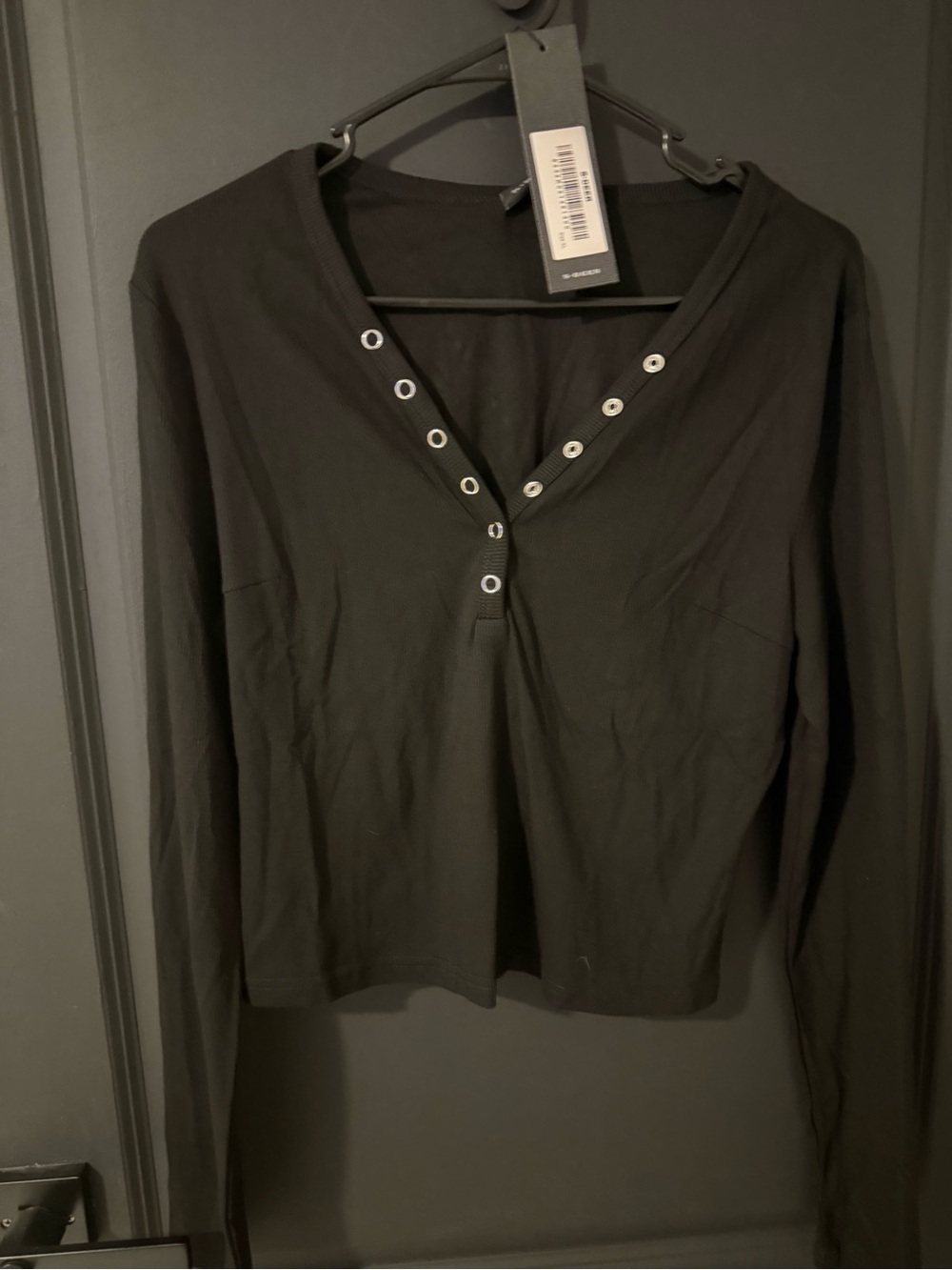 Black Long-Sleeve V-Neck Top with Grommet Accents